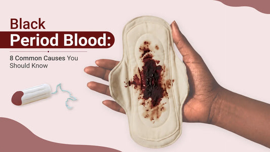 Reusable menstrual pad with black period blood held in a person's hand, illustrating older oxidized menstrual blood and highlighting common causes of black period blood during menstruation.
